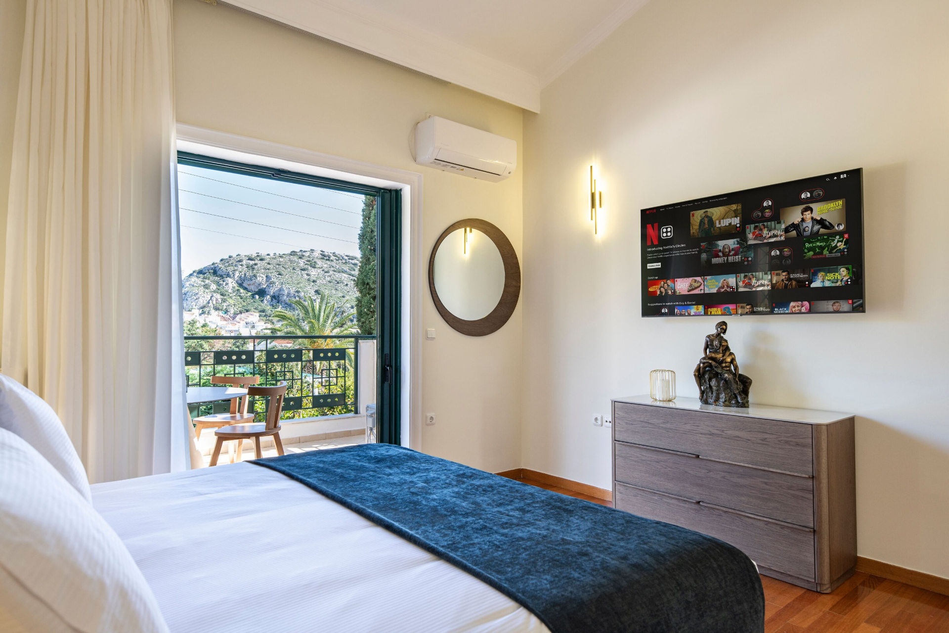 Bedroom with balcony and smart TV